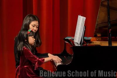 Piano student performing with her teacher Esther Joh Recital Dec. 2012