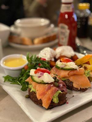 Salmon avocado toast with poached eggs and sweet potatos