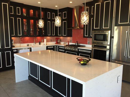 Renovated kitchen with LED lighting - recessed cans, pendants, and puck lights.