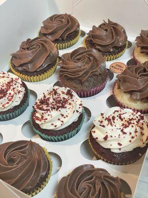 Assorted customized cupcakes redvelvet chocolate. And gluten free and dairy chocolate and vanilla cupcake.