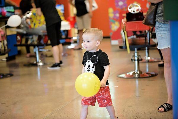 This little man knows his priories: Mickey, balloon, sucker. #CookieCuttersWestChesterPA #haircutsarefun #Kidshairsalon