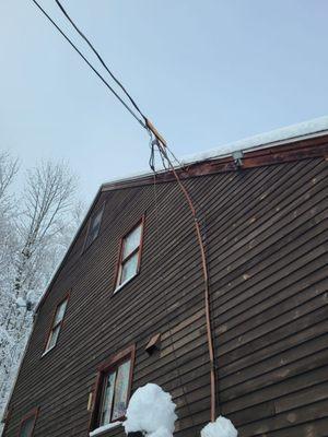 House damage before the repair.   Three stories up.