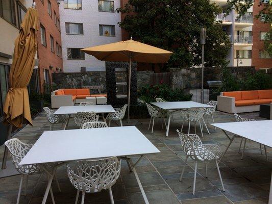 Outside patio with two grills.