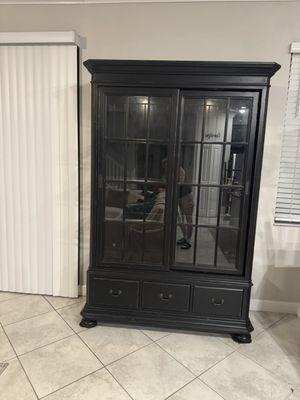 large wood and glass hutch with glass shelves