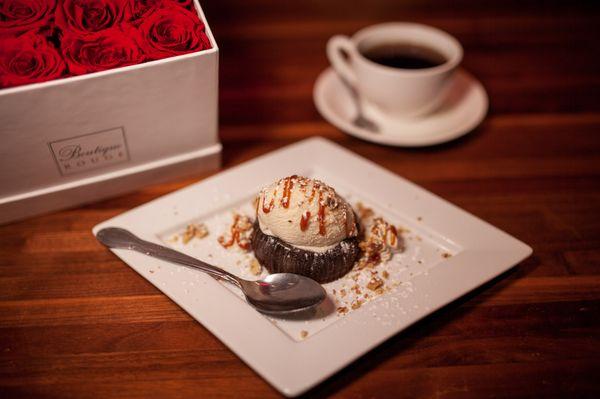 Chocolate Fondant, lava cake with vanilla or chocolate ice cream drizzles with caramel sauce, topped with homemade whipped cream