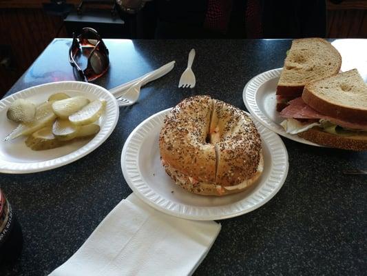 Lox cream cheese bagel and salami sandwich