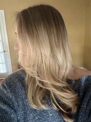 Side view of blonde balayage and angle with long layers