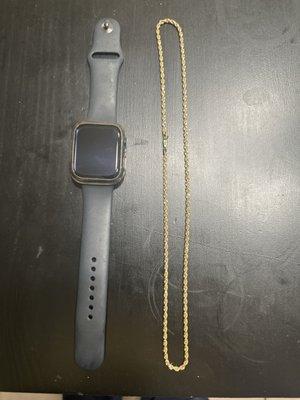 Gold 2200 rope chain used the watch as size reference.