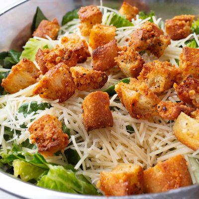 Caesar salad: Freshly chopped Romaine lettuce topped with our house-made croutons, shredded Parmesan, and a pinch of black pepper.