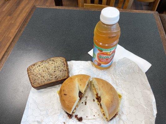 Banana bread, Apple Juice and an Egg, bacon and cheese bagel.