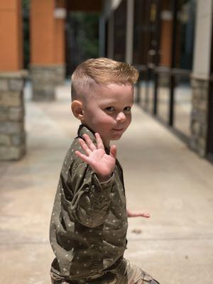 So handsome; he's so excited about his haircut and style