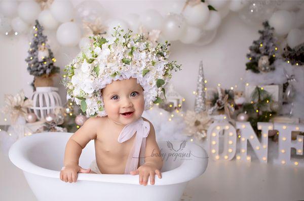 Enjoying her little bath to make cleaning up fun!