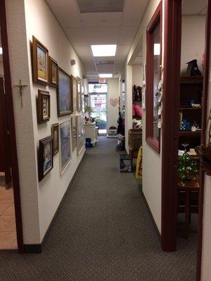 One of the hallways, art on the walls for sale, leading to the ten treasure-filled rooms.