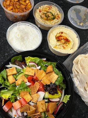 Batata harra (potatoes), hummus, garlic sauce, baba ghannouj, fattoush salad