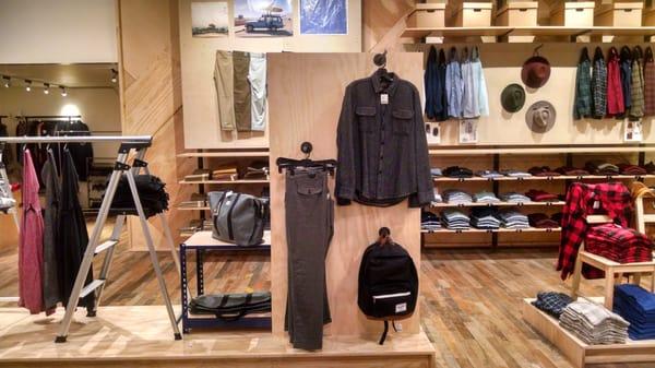 Men's clothing in the rear of the store.