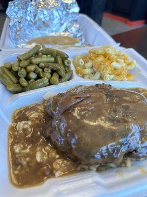 Salisbury steak and gravy over rice, with green beans and mac-n-cheese