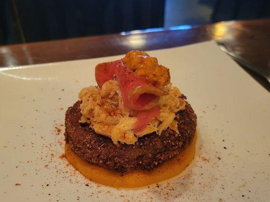 Crabmeat on a fried green tomato topped with uni and apple kimchi