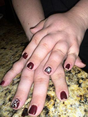 Red glitter gel nails with a HAND DRAWN spider design