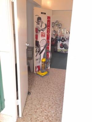 Mens shower room has a door into the Tennis shop (WTF?)