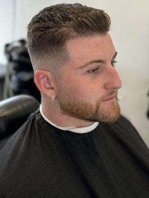 Skin fade with scissors trim on top