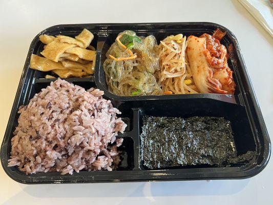 Banchan: fishcake, Japchae, kimchi, purple rice, seaweed