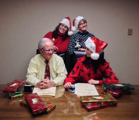 Taking a break to pose for Savers Bank's ugly Christmas sweater contest.