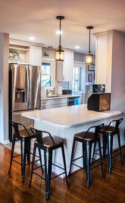 Modern Kitchen with white cabinet and subway backsplash and hardwood floor Design and installed by Aladdin carpet and floors