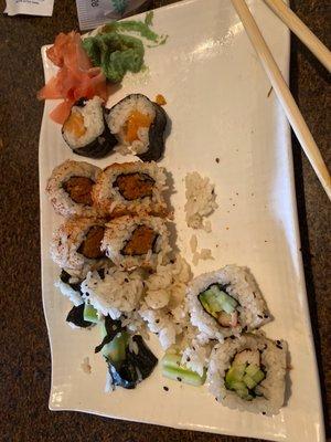 Sushi roll lunch with salmon, spicy tuna, and California roll