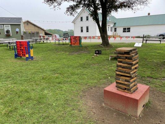 Seating and games area near ice cream stand