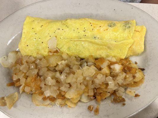 Omelette and fried potatoes with grilled onion