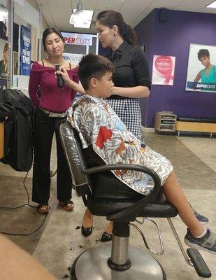 Kim cutting my son's hair.