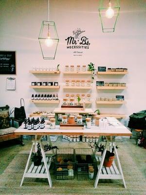 Love the style of this display of Mr. B's candles and skincare products.