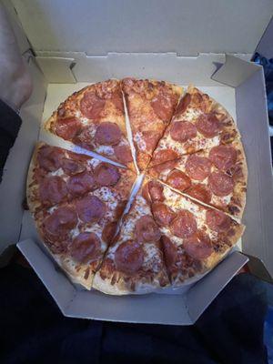 Pepperoni pizza with spots missing cheese