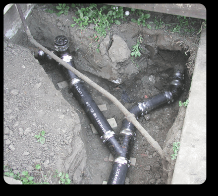 This was a sewer line that kept getting clogged. We repiped and regraded it. The main line went to a house, while an addition...