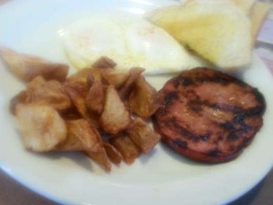 Redless red potatoes...nicely burnt ham slice... But....excellant eggs.