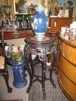 antique Chinese table with vase, American art pottery and Victorian chest.