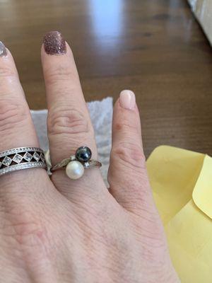 My Grand Mother's black and white pearl ring. The black pearl was falling off. Dyer's has it affixed firmly and sized it as well!