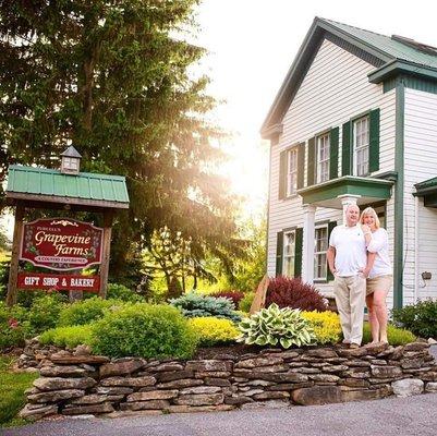 Tim and Tracy Purcell in front of Grapevine Farms