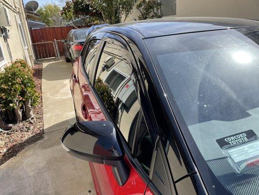 Front windshield strip and passenger side windows w/smoked wind visors (not from Discovery Tint)