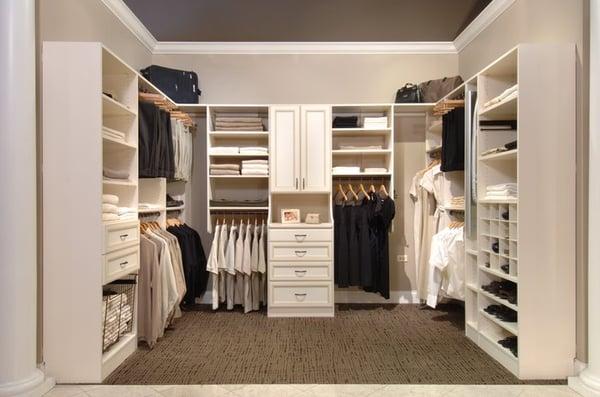 Bisque walk in closet with glazed finish on drawers