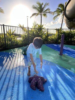 Infant and toddler gated splash pad area