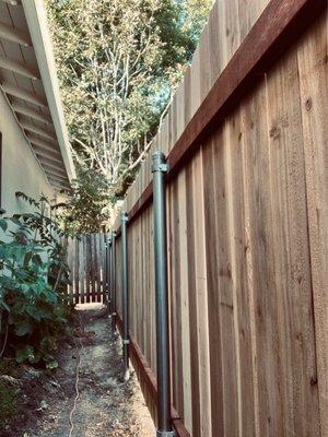 Wood fence on steel posts