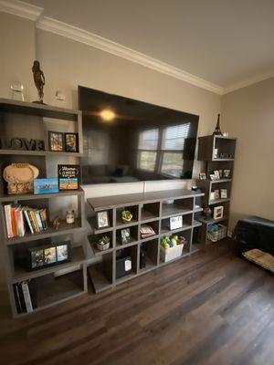 Hallway stand w/ 2 book shelve stands . Customer using as tv entertainment set. Very creative .