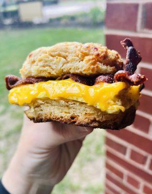 Garlic cheese biscuit with bacon, egg, and cheddar