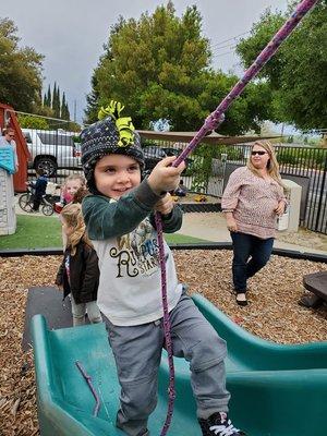 The rope climb! One of our favorite outdoor fine motor skill activities!