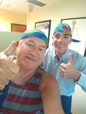 Dr. Todd and his patient wearing matching hats!