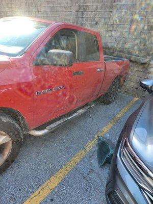 Another truck busted window same lot