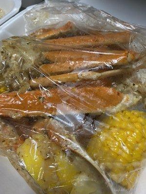 Craybays Garlic Butter Crablegs with corn and red potatoes.