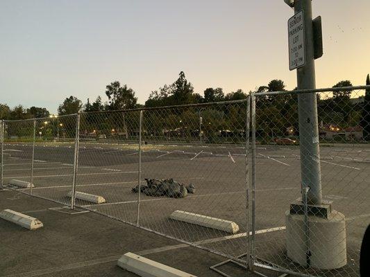 Parking is fenced off, now what are they doing?