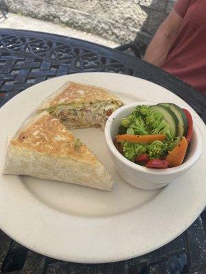 Chicken salad sandwich on wrap (served warm) with fresh vegetable medley.